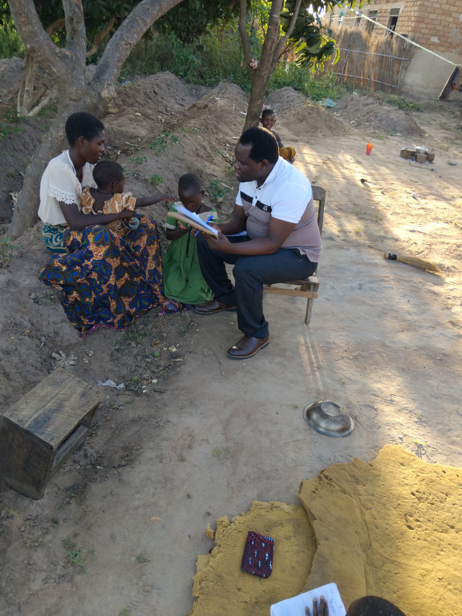 Researcher speaking with caregiver at home