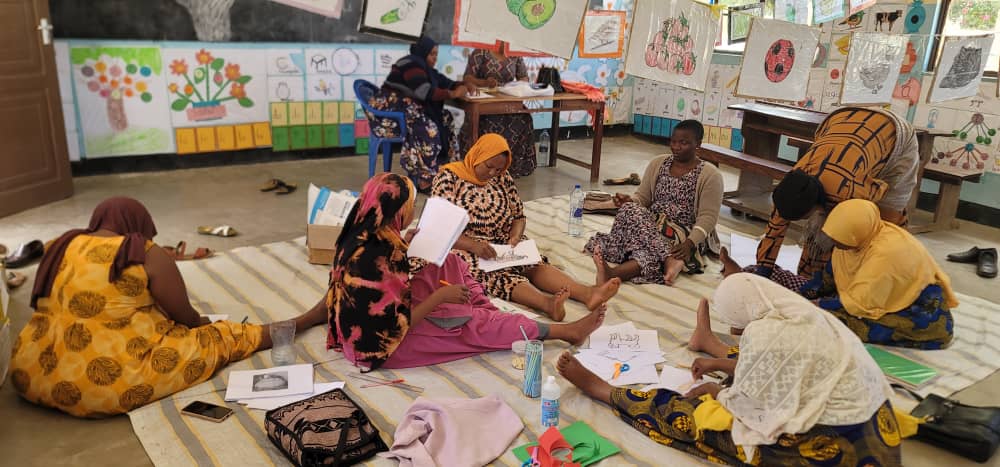 Caregiver showing improvised learning materials at home