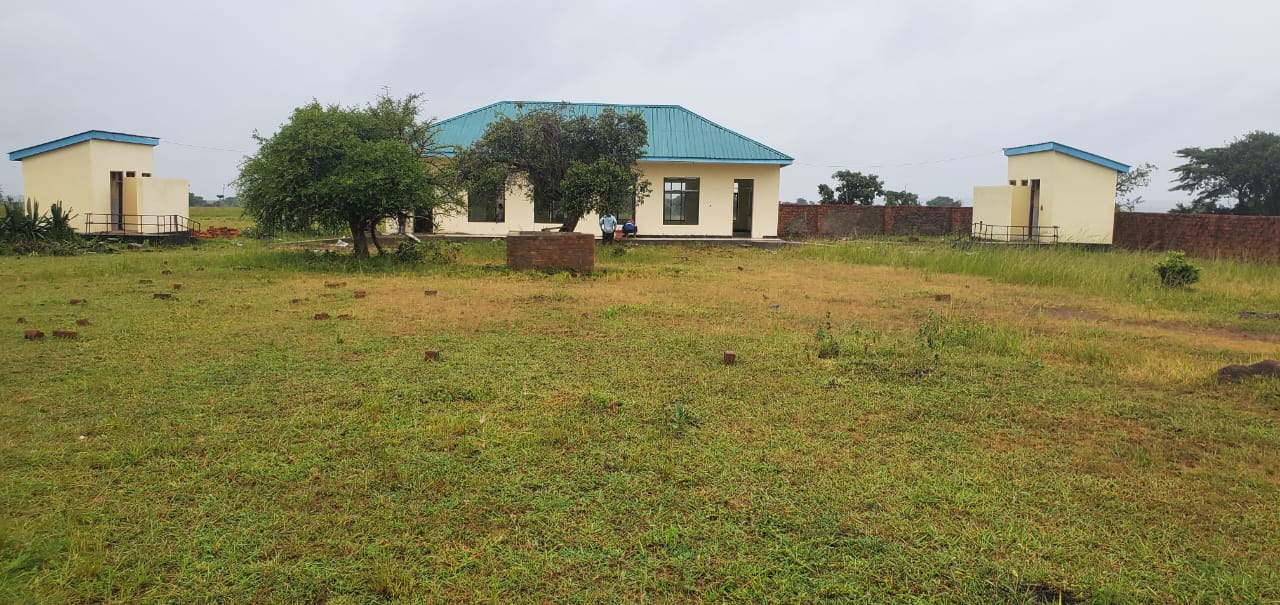 Enumerator navigating uneven terrain after rain